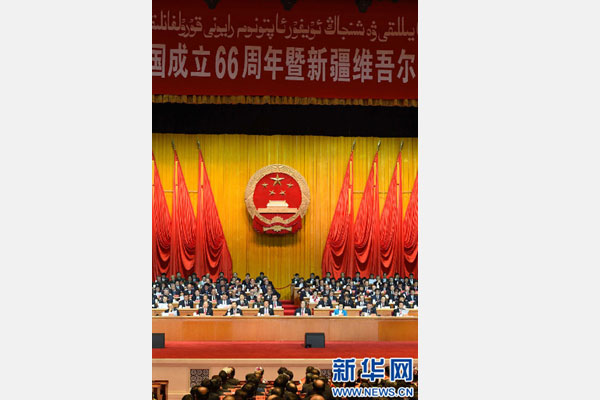 10月1日，慶祝中華人民共和國(guó)成立66周年暨新疆維吾爾自治區(qū)成立60周年大會(huì)在新疆人民會(huì)堂隆重舉行。 新華社記者 高潔 攝 